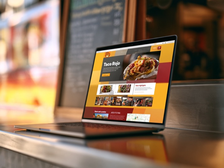 The Table adapted for a taco food truck: homepage with a full-width food photo hero with a short headline and a “see the menu” button